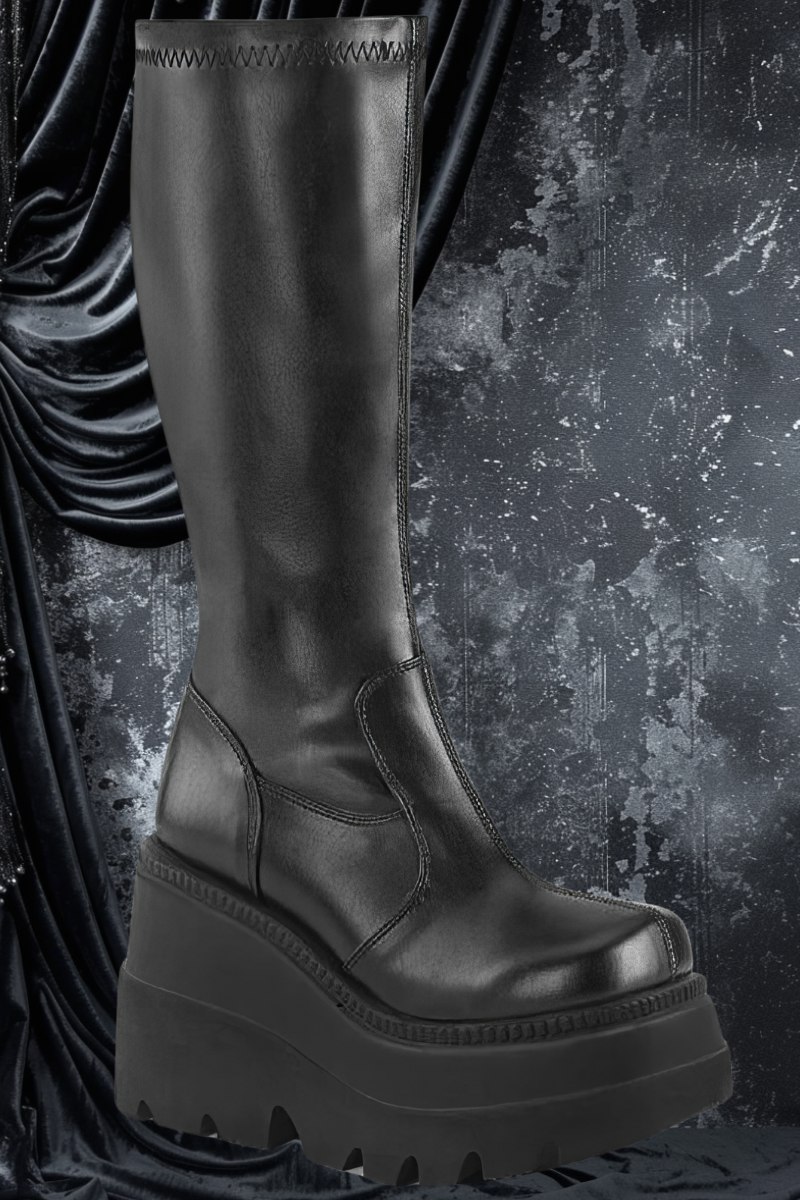 Botte gothique noire Nightveil Boots en cuir synthétique avec plateforme épaisse et tige haute lisse
